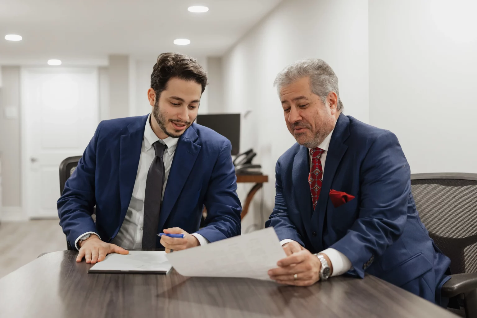 Thomas Ciccotta and Reno Ciccotta of Reno Law reviewing documents together